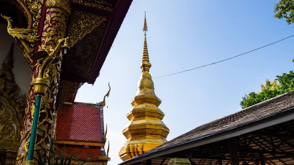 Golden pagoda in Phrathat Chom Sin temple