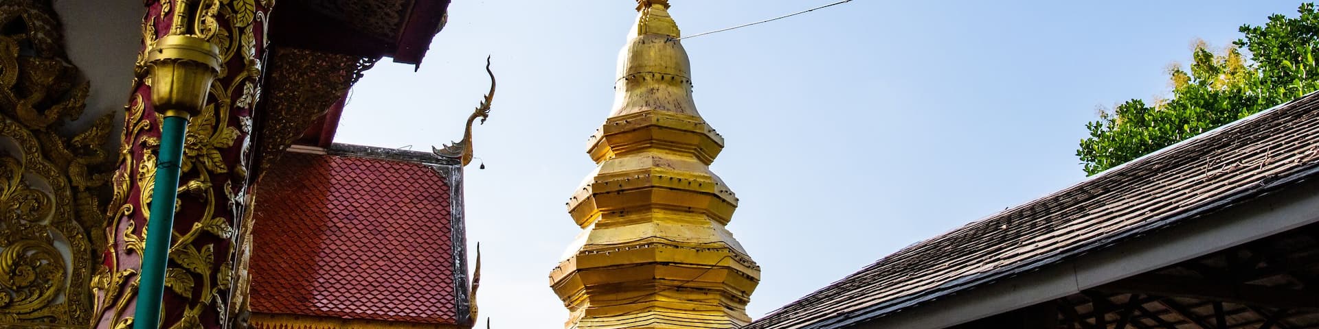 Golden pagoda in Phrathat Chom Sin temple