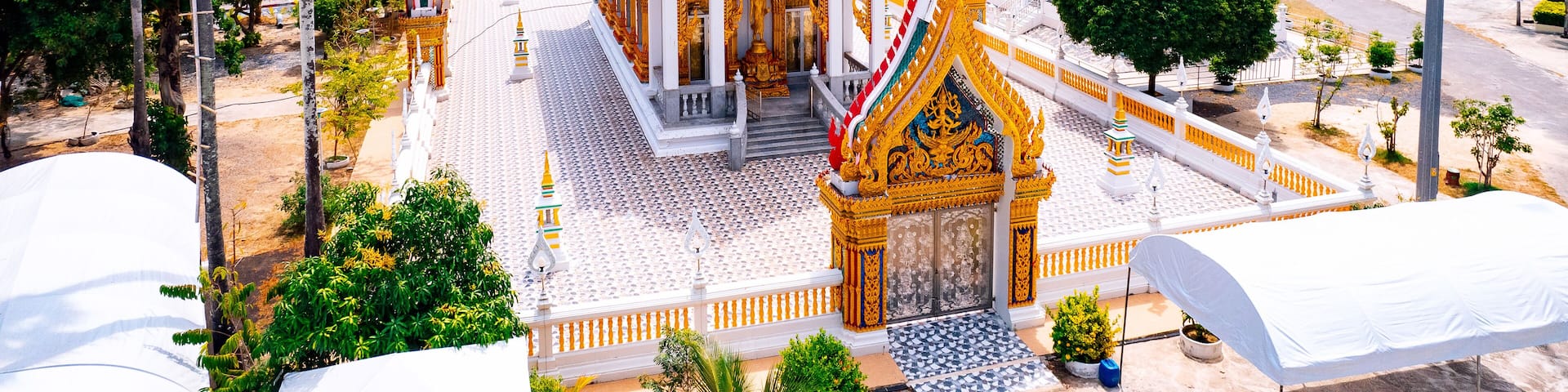 Aerial view Buddhist Nai Harn temple Wat in Phuket island, Thailand on sunset light. Buddhism religious tourist attraction, Landmark for tourism.