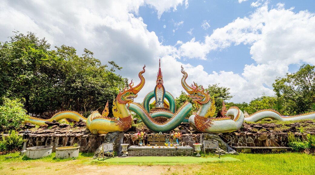 Ubon Ratchathani, THAILAND - August 8, 2023: Buddhist travel glowing serpent statue with sunlight at Wat Pa Phu pang temple, Si Chiang Mai District, Ubon Ratchathani Province, Thailand.