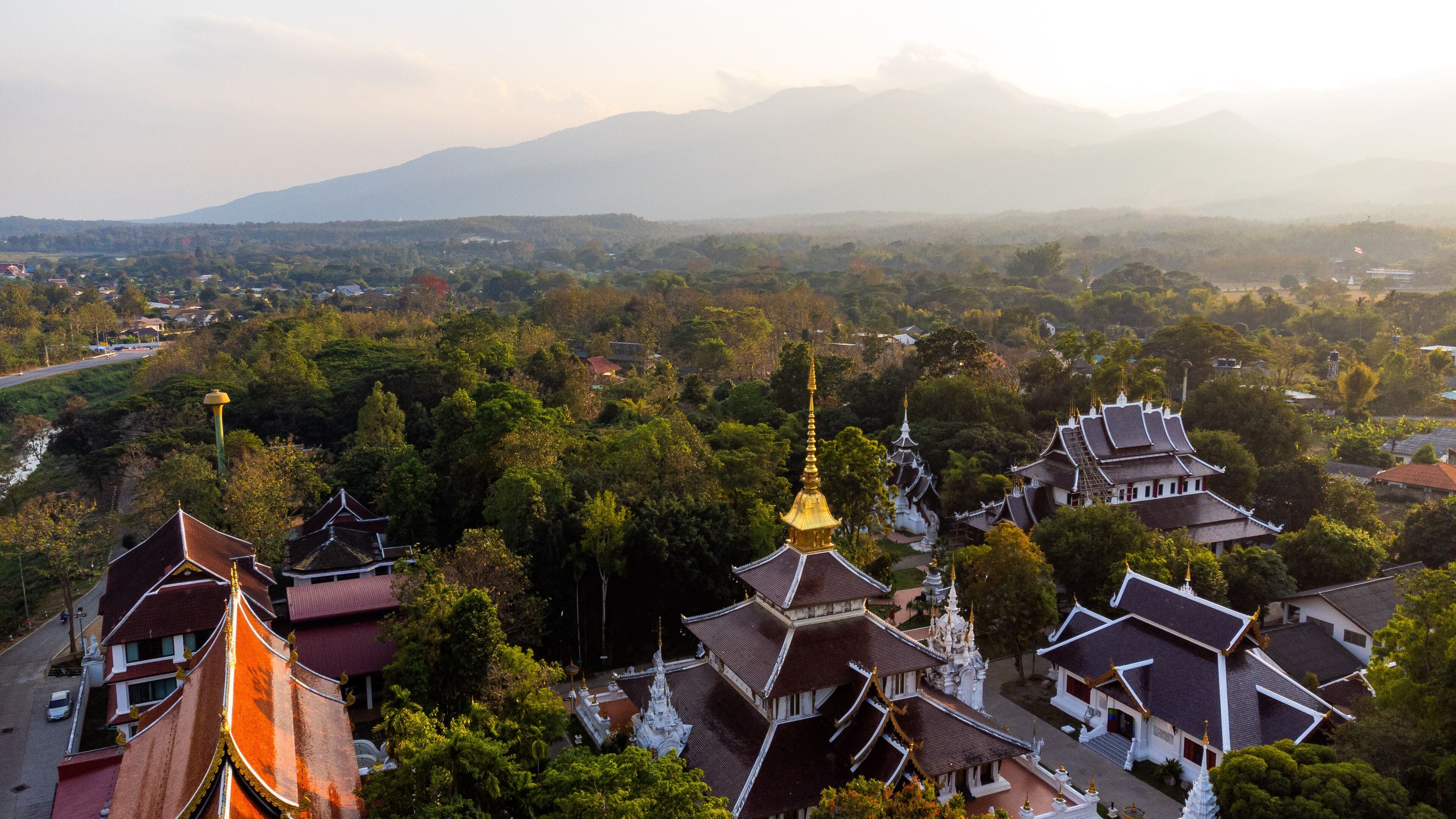 Wat Pa Dara Phirom Temple gleaming under sunset light in Mae Rim, Chiang Mai, Thailand