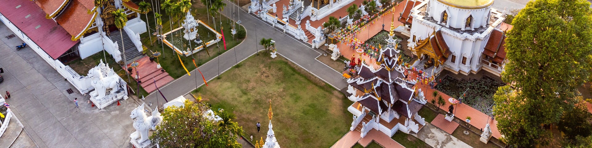 Wat Pa Dara Phirom Phra Aram Luang temple complex shining in golden hour light, Mae Rim, Thailand