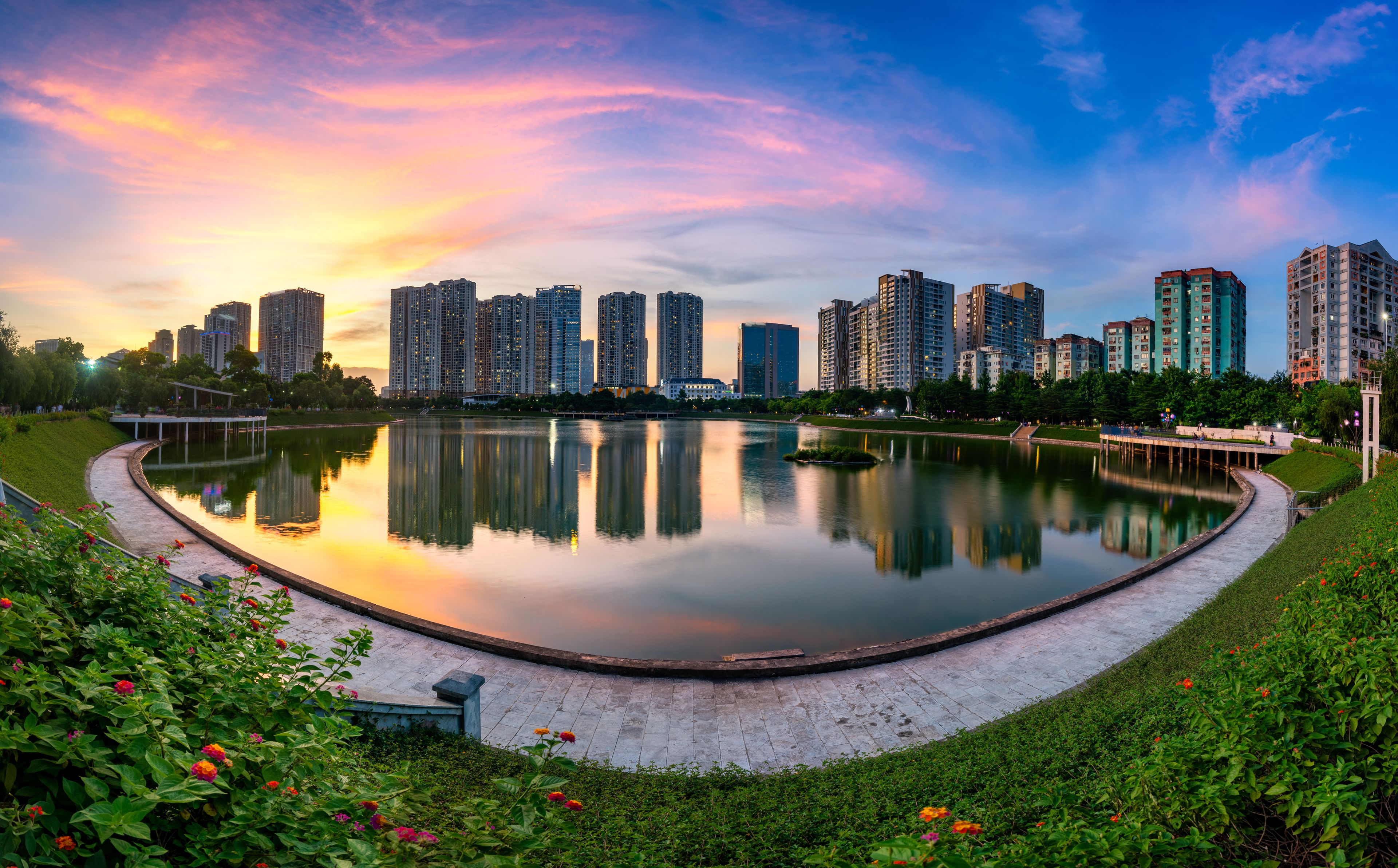 Cityscape of Hanoi skyline at Thanh Xuan park during sunset time in Hanoi city, Vietnam
