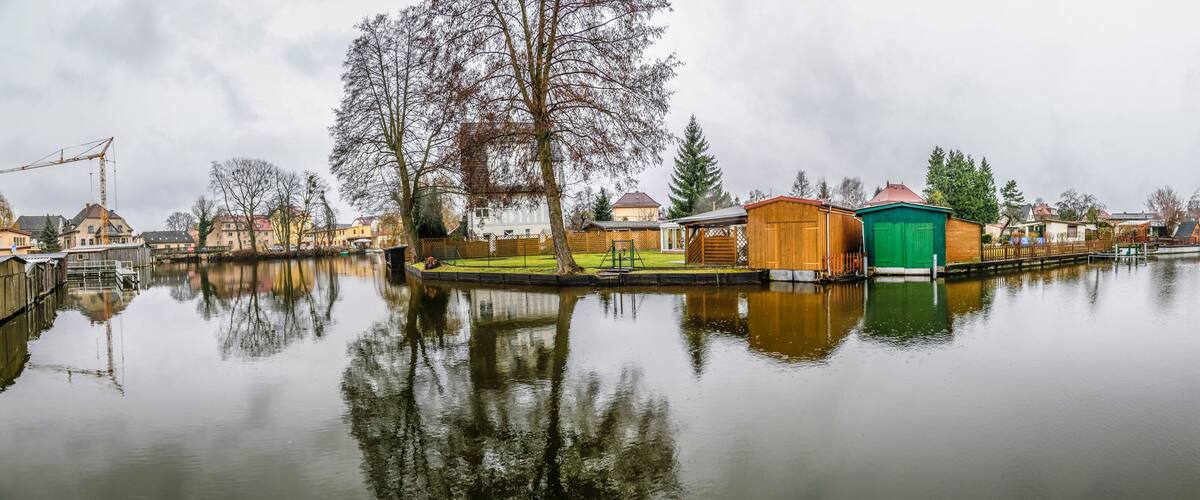 small village at the river Havel with private piers and huts in former east Germany