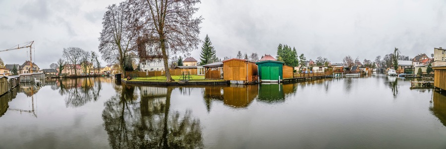 small village at the river Havel with private piers and huts in former east Germany