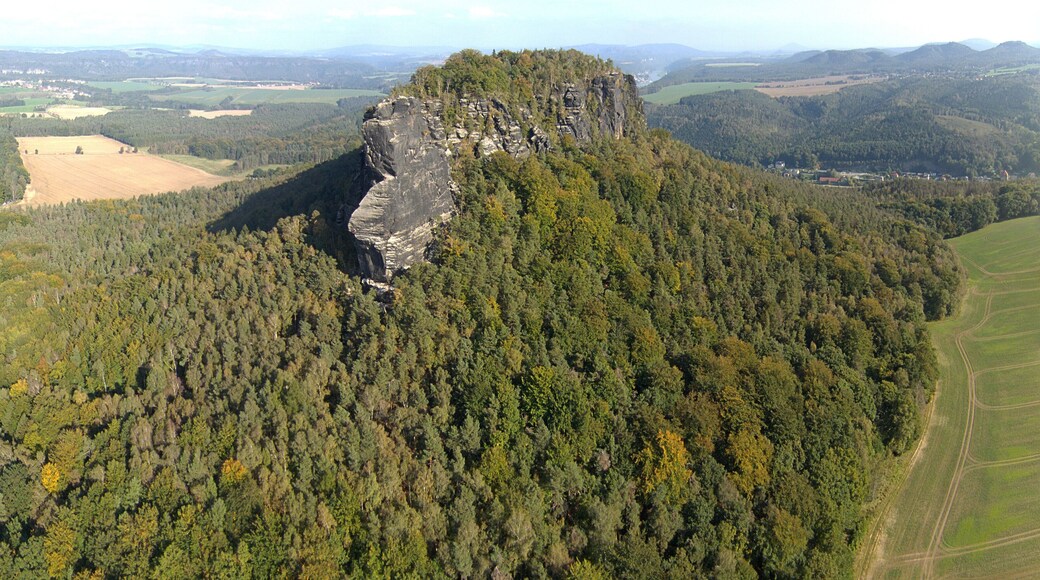 Aerial picture of one of the few table mountains on the east of the river Elbe called Lilienstein in Saxon Switzerland, in Saxony, southeastern Germany which constitutes the symbol of the Saxon Switzerland National Park; climbers are visible while climbing the mountain.