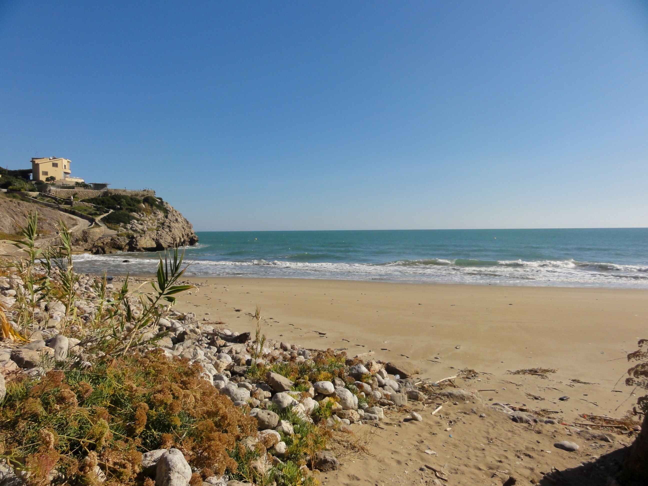 This is a a photo of a beach in Catalonia, Spain, with id:
