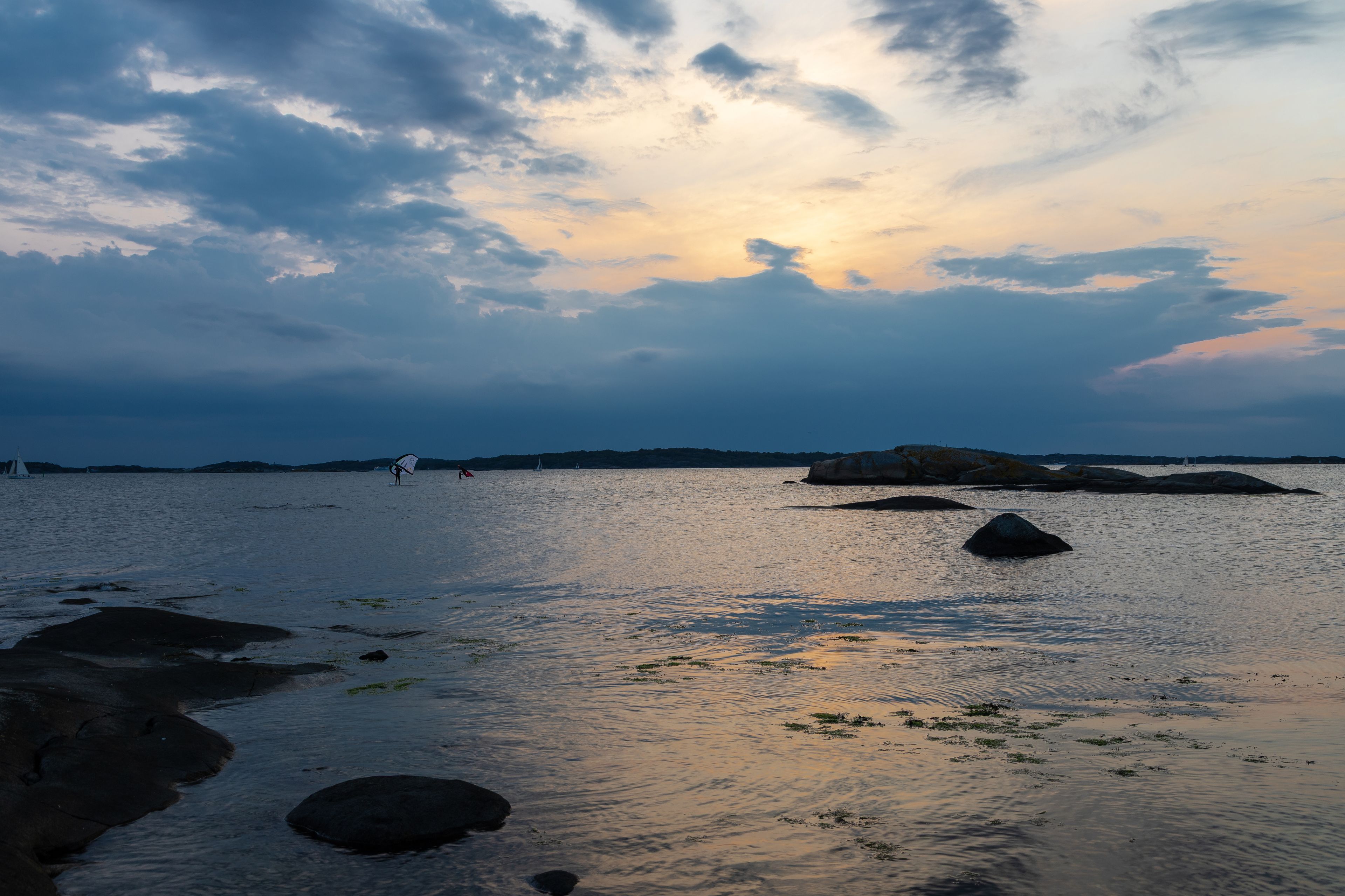 Colourful sunset over the Baltic Sea and the Swedish archipelago near Gothenburg seen from the village of Vastra Frolunda, which is characterised by beautiful scenery, amazing shaped boulders and unto