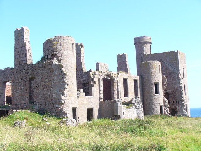 An ancient stone castle with multiple towers and ruins.