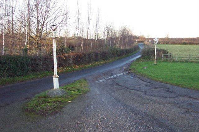 Lamp posts by the entrance to The Masons Arms at Hopperton Looking north towards the junction with the A59