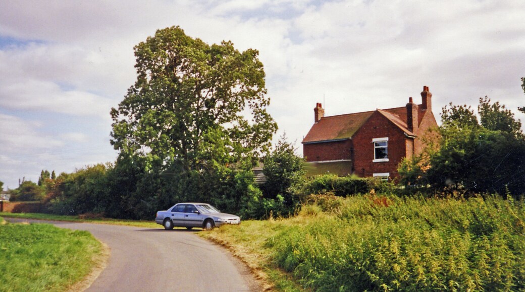 Former Station House at Fockerby. View SE: my Honda Accord waits by the north side of the former station, which was the terminus of the branch from Reedness Junction, Isle of Axholme Light Railway (NE & L&Y Joint), which last saw passengers on 17/7/33, goods 5/4/65.