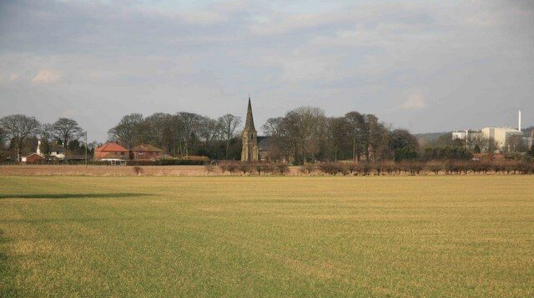Across the fields to Amcotts Amcotts village in the distance with the church standing out in the afternoon sun.