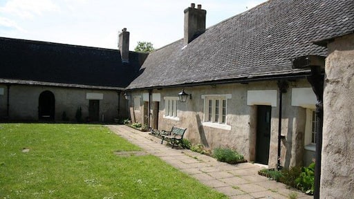Almshouses Dating from 1660, a neat courtyard of cottages by the church