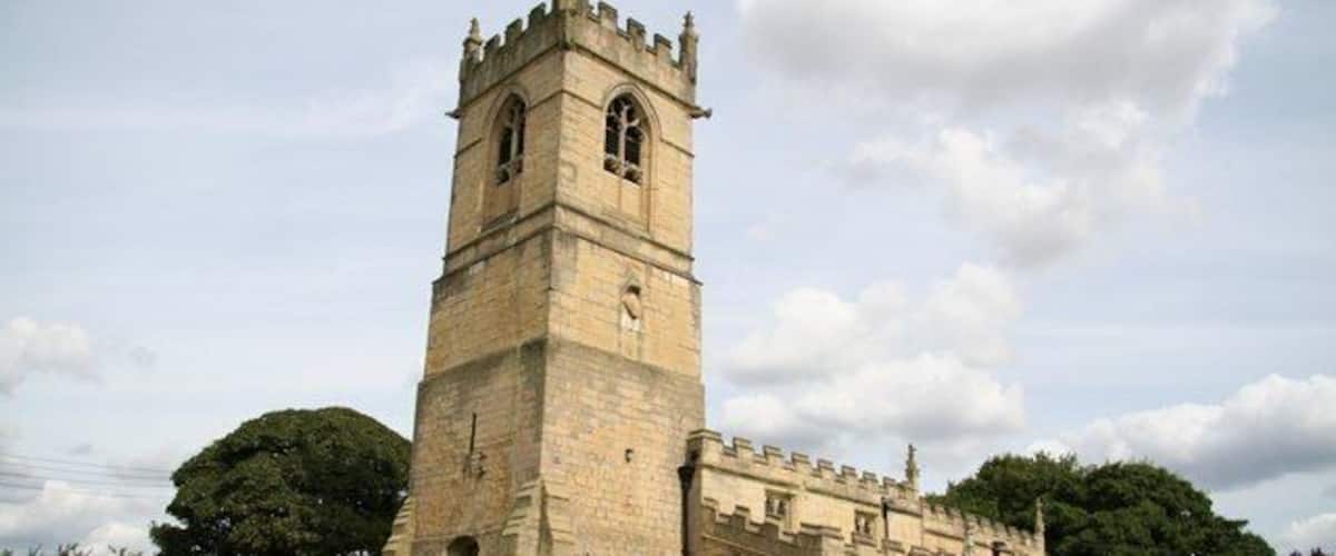 St.Peter's church Norman tower with 15th century top and crenelation all round
