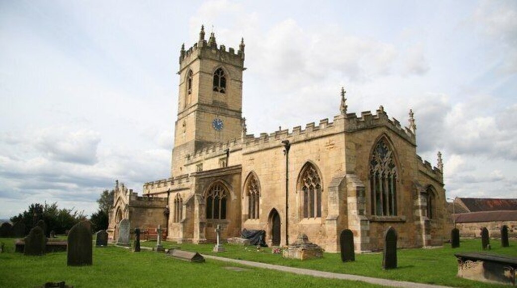 St.Peter's church Norman tower and 15th century crenelations, but the windows are largely early 14th century Decorated with rectilinear tracery