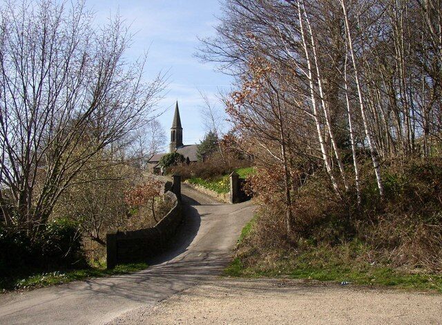 The approach to the church, Brockholes St George's church is built on The Rock, and the way to it is along the lane past the National School and then up a drive between gateposts like those for a Victorian house.