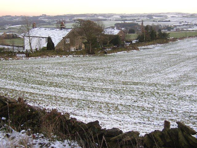 Height, Thurstonland. This farm is at 260m AOD, so the name is appropriate. The area around it is called Height Green. The building on the right has a clock in the gable, not as clear on the photo as I had hoped for. St Thomas's Church, Thurstonland village, is in the background.