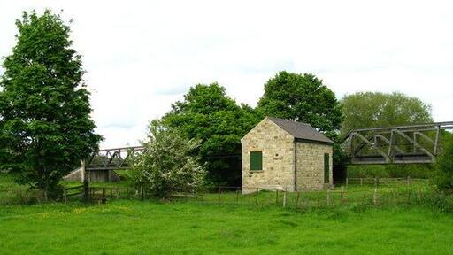 Catterick Bridge Flow Gauging Station on the banks of the Swale. The girder bridge in the background used to carry the Catterick Garrison Railway over the river.