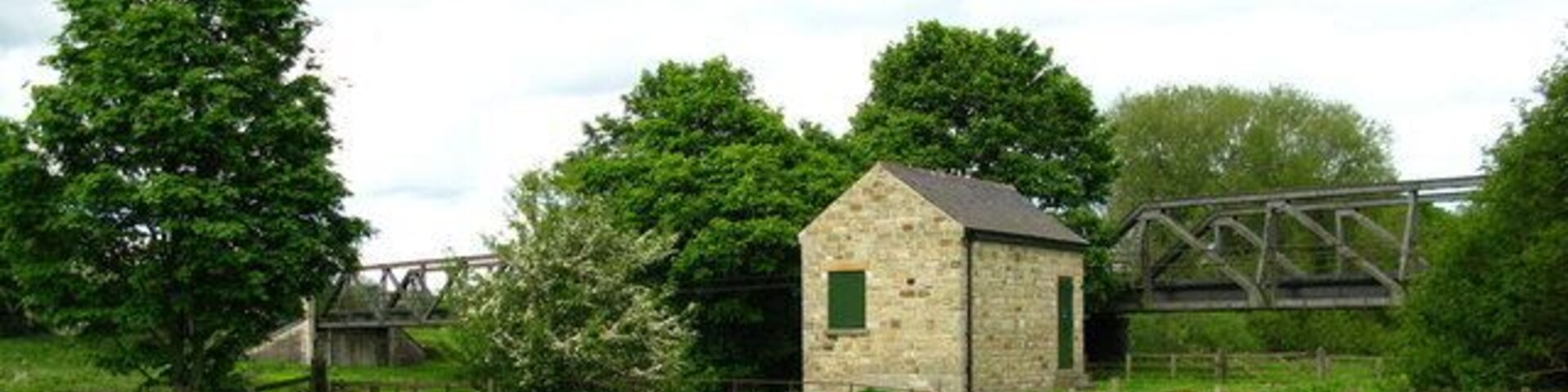 Catterick Bridge Flow Gauging Station on the banks of the Swale. The girder bridge in the background used to carry the Catterick Garrison Railway over the river.