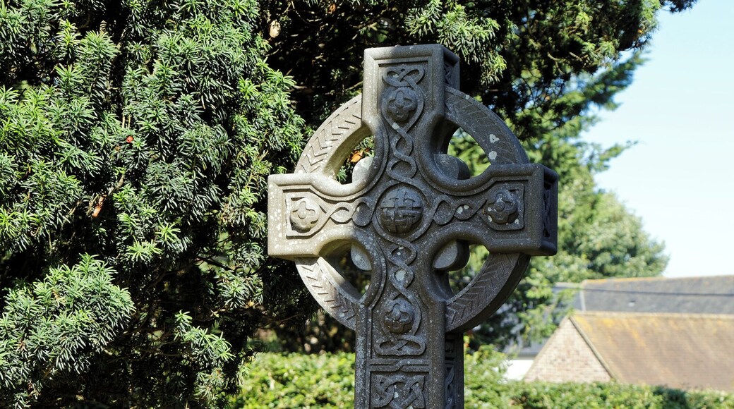 A churchyard memorial cross to Rev. James Oliver Bevan (1843-1930), to the north of the Grade II* listed All Saint's Church, which dates between the 12th and 15th century, with later 1871 restoration by George Gilbert Scott, in Chillenden, in the civil parish of Goodnestone and the Dover District of Kent, England. Camera: Canon EOS 6D with Canon EF 24-105mm F4L IS USM lens. Software: RAW file lens-corrected, optimized, perhaps cropped, and converted to JPEG with DxO OpticsPro 11 Elite, and likely further optimized with Adobe Photoshop CS2.