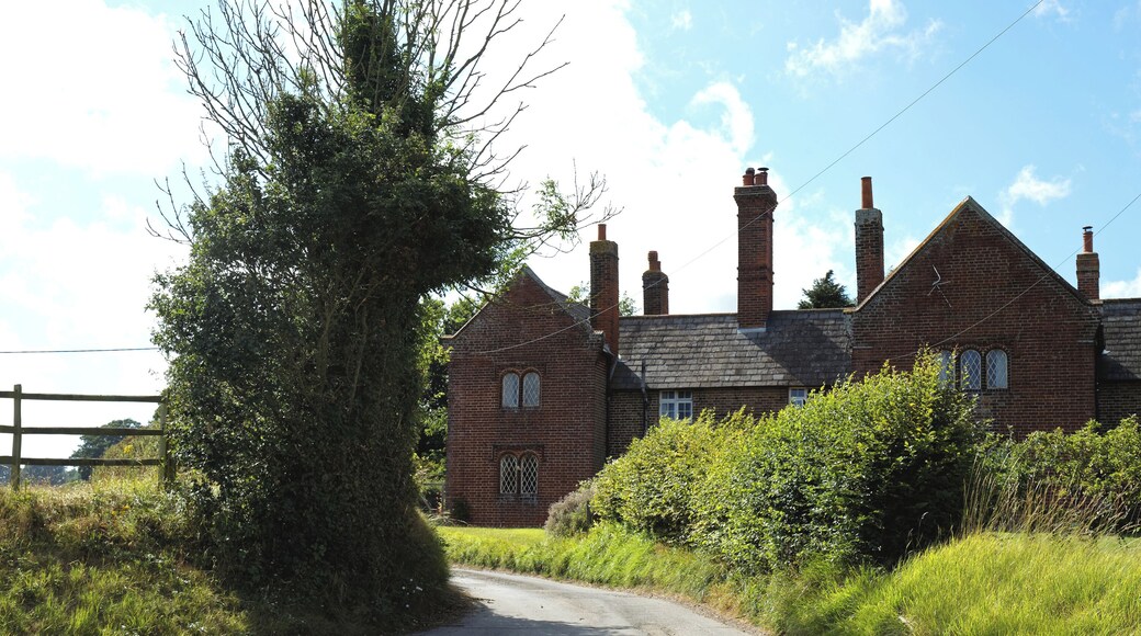 A gabled building converted into residential units on Station Road in Chillenden, in the civil parish of Goodnestone and the Dover District of Kent, England. Camera: Canon EOS 6D with Canon EF 24-105mm F4L IS USM lens. Software: RAW file lens-corrected, optimized, perhaps cropped, and converted to JPEG with DxO OpticsPro 11 Elite, and likely further optimized with Adobe Photoshop CS2.