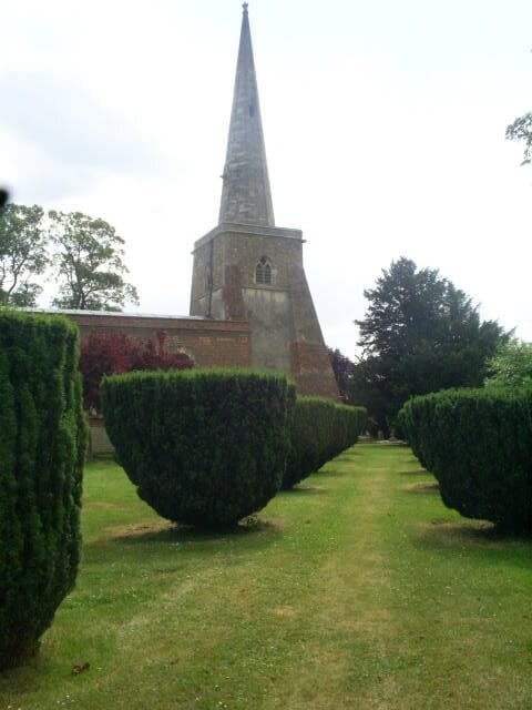 St Mary's Church, Connington Clipped yews are a feature of this fenland church.