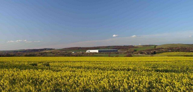 The still vacant Prologis shed sticks out of the Dearne Valley on a warm Spring evening Built on the site of the former Houghton Main Colliery.