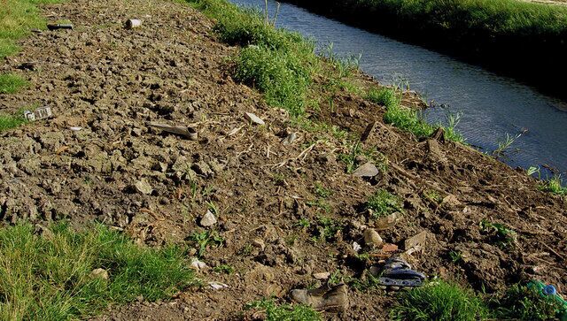 Flipper, boot, roller blade, cuddly toy! Debris from newly dredged dike.