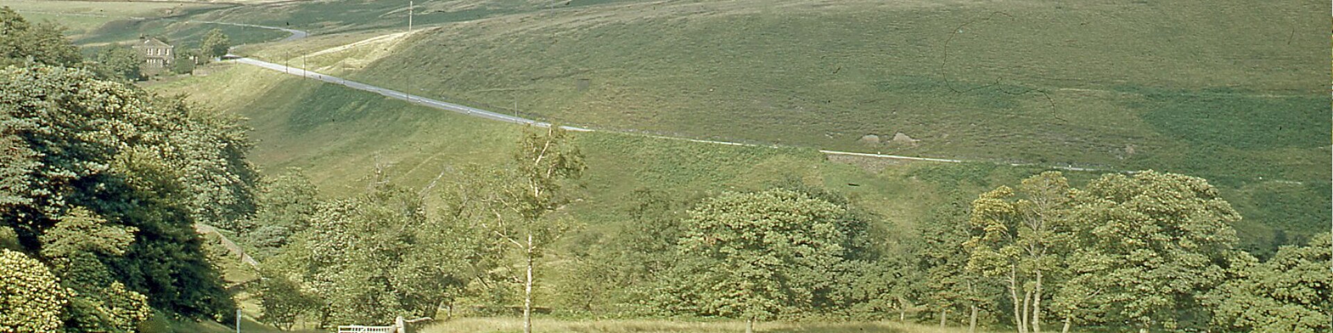 Moorland north of Dunford Bridge, 1968. View NW from Dunford Bridge, over new Winscar Reservoir (hidden) to Snailsden Fell (1,565 ft.), at site of temproary Balfour Beatty workers' camp during construction of New Woodhead Tunnel (1949-54)
