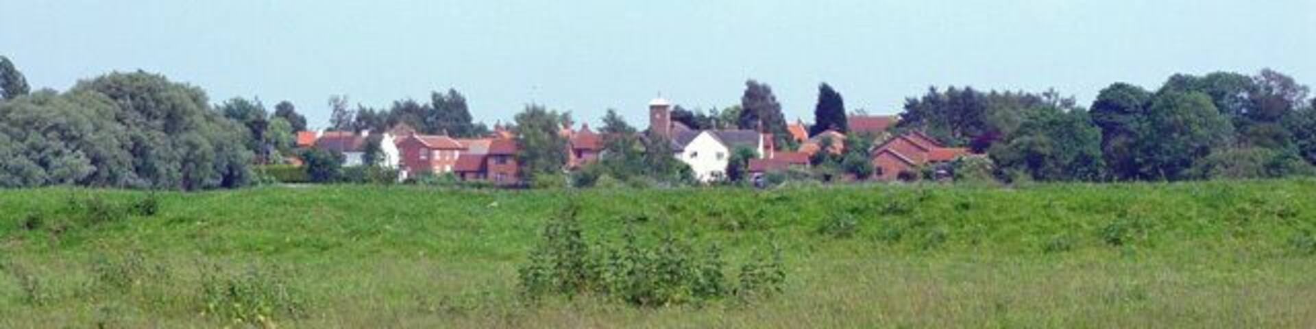 Village of East Cottingwith, East Riding of Yorkshire, England. As seen across the green area, and from the bank of the Pocklington Canal.