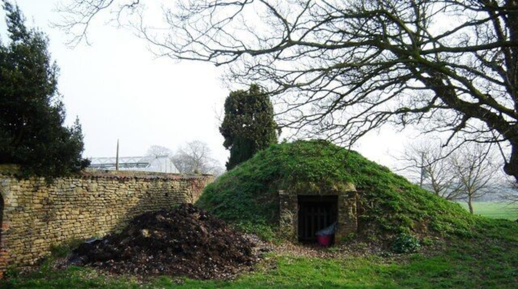 Old Ice House Hotham Hall, Hotham, East Riding of Yorkshire, England. The wall to the left is the walled garden for the Hall. The footpath runs past the Ice House across The Park to North Cave.