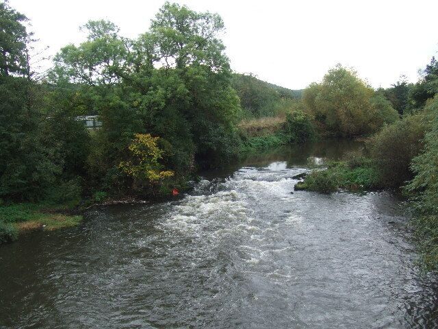 The River Don from Kilnhurst bridge. The Don flows through Sheffield, Rotherham and Doncaster. Sometimes the level rises ten feet or more above this quiet flow.