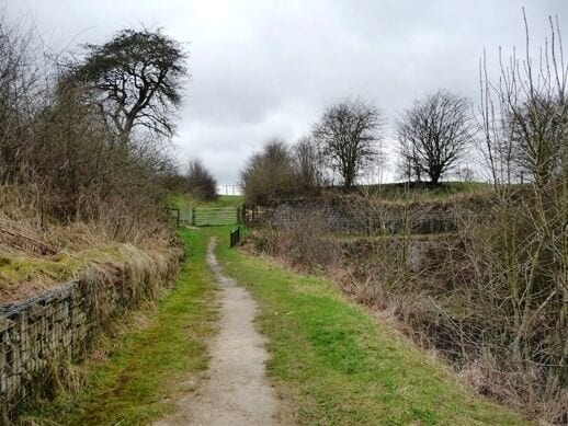Path over the summit. The Chesterfield Canal tunnelled its way through the highest ground it had to cross, between Norwood and Kiveton Park. Norwood Tunnel is 2,633 metres long and has no towpath. The horses which pulled the boats had to be walked 'over the top' along this path.