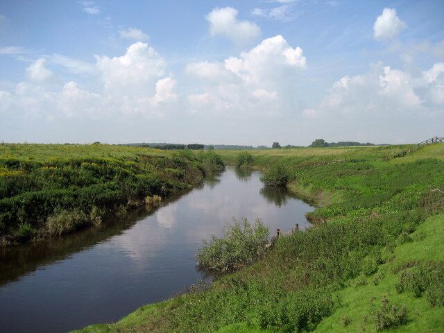 River Swale near Far Fairholme The river at this point is a pale shadow of the glories it experiences in the Yorkshire Dales. Here it meanders in a large green ditch at a sluggish pace.