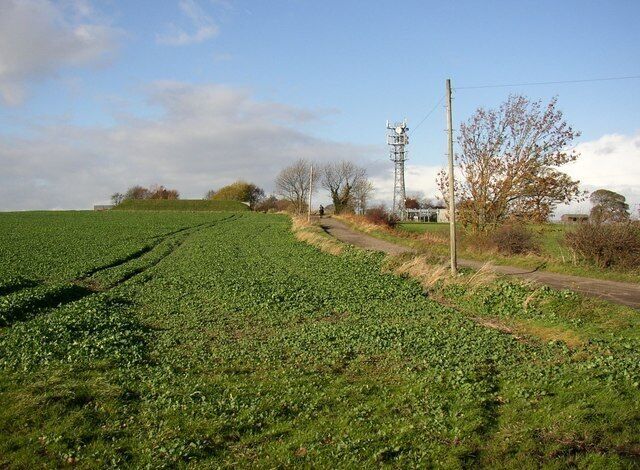 Smithy Lane from Chapel Hill, Overon. Sitlington CP This leads to Old Road through the village of Overton. The mound on the left is a service reservoir.