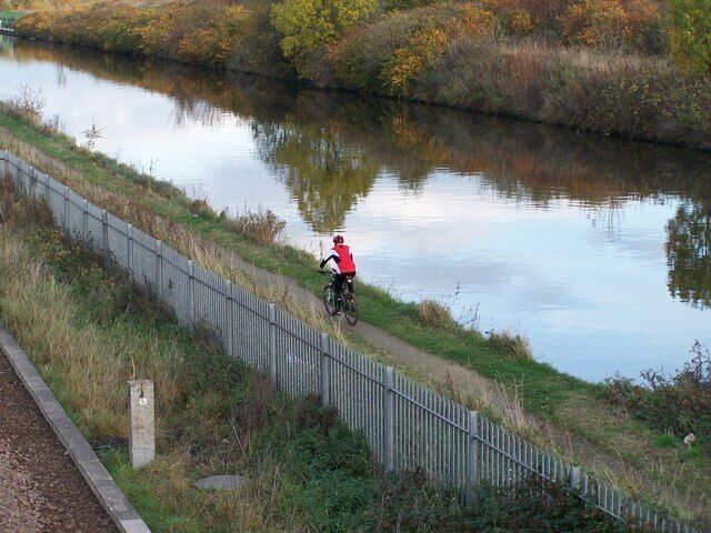 Towpath Cyclist, Parkgate, Rotherham. The Canal Towpath was originally used by horses towing canal barges ... now used by walkers and cyclists 1567100 1567084