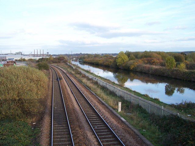 Railway and Canal, Parkgate, Rotherham. Chimneys at Corus Steelworks at Aldwarke are in the far distance ... served by the railway lines. The canal is locally known as the Rotherham Cut. Two one-time competitors now peacefully growing old together. 1567071 1567084 1567116