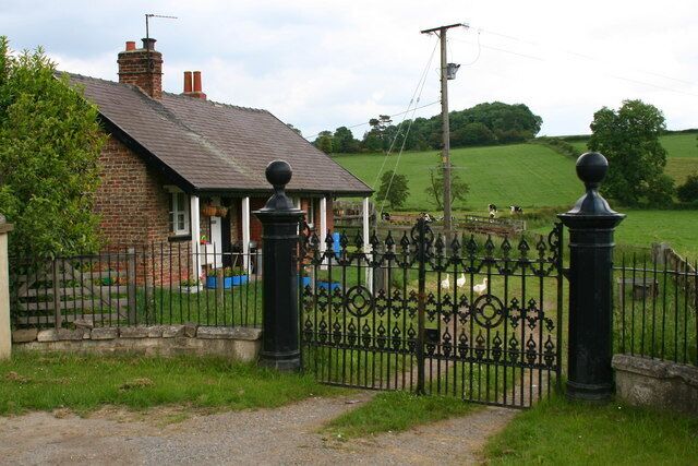 Risley Lodge The Lodge stands inside these impressive gates which guard a track over Markington Beck and on to a modern house named Risley or Riseley, perhaps an indication that this was the entrance to a much grander house in the past.