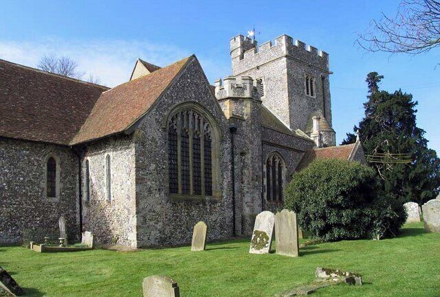 A church with a tower and a graveyard.