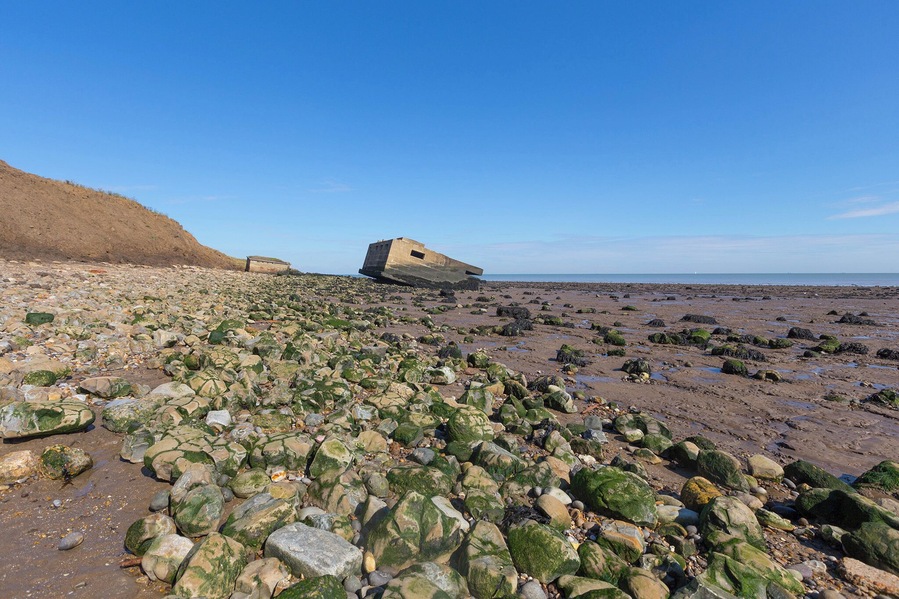 Park up and stroll along the coastal footpath where erosion of the cliffs has seen these two WWII lookout posts fall onto the beach.