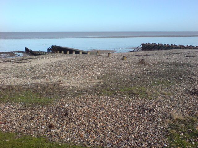 Beach at Warden Bay Looking out towards some groynes and what may once have been slipway supports.