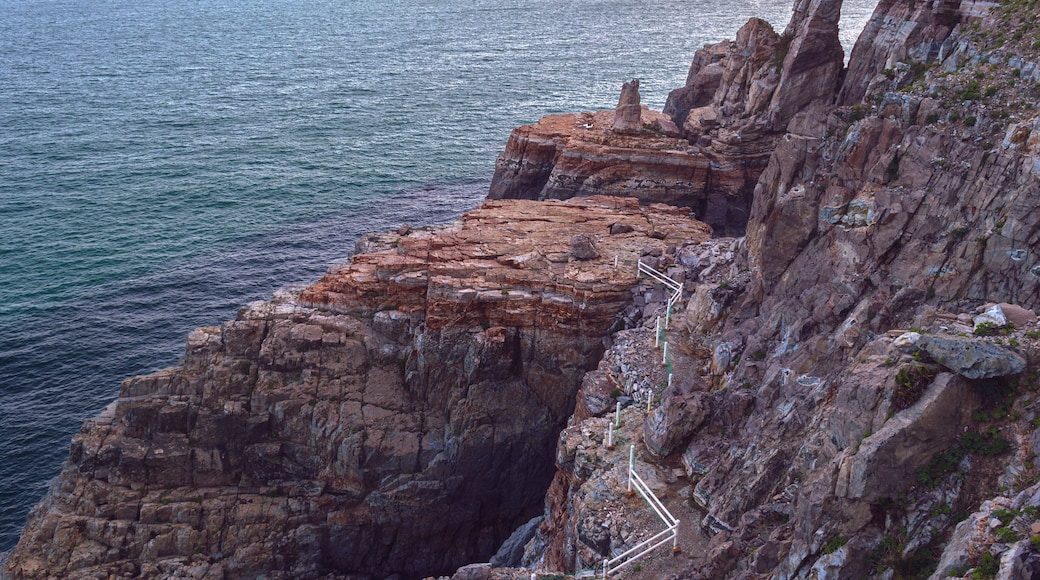view from above on bay and rugged cliff