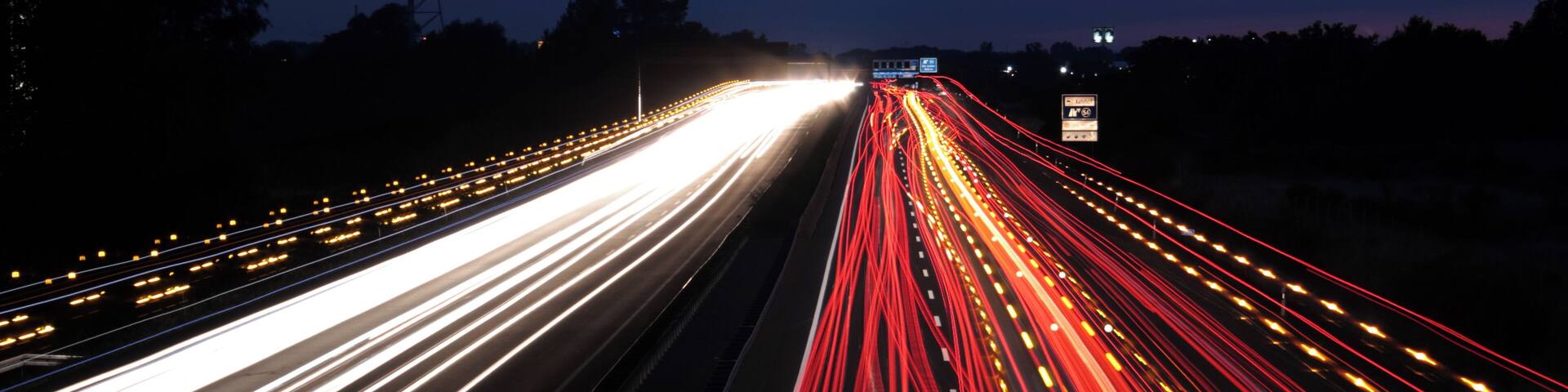 Bundesautobahn 2 near Braunschweig (Brunswick), Germany. The yellow speckles are caused by the flashing lights of transports with oversized loads and their pilot cars.