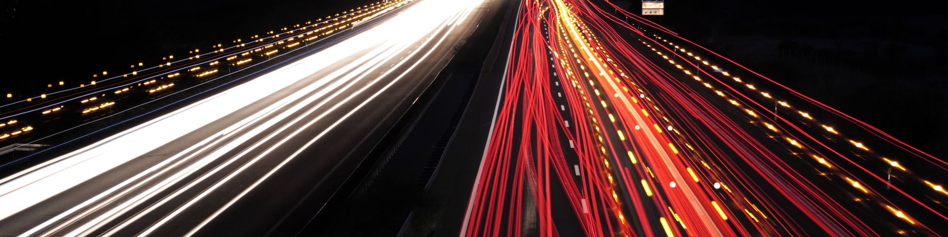 Bundesautobahn 2 near Braunschweig (Brunswick), Germany. The yellow speckles are caused by the flashing lights of transports with oversized loads and their pilot cars.