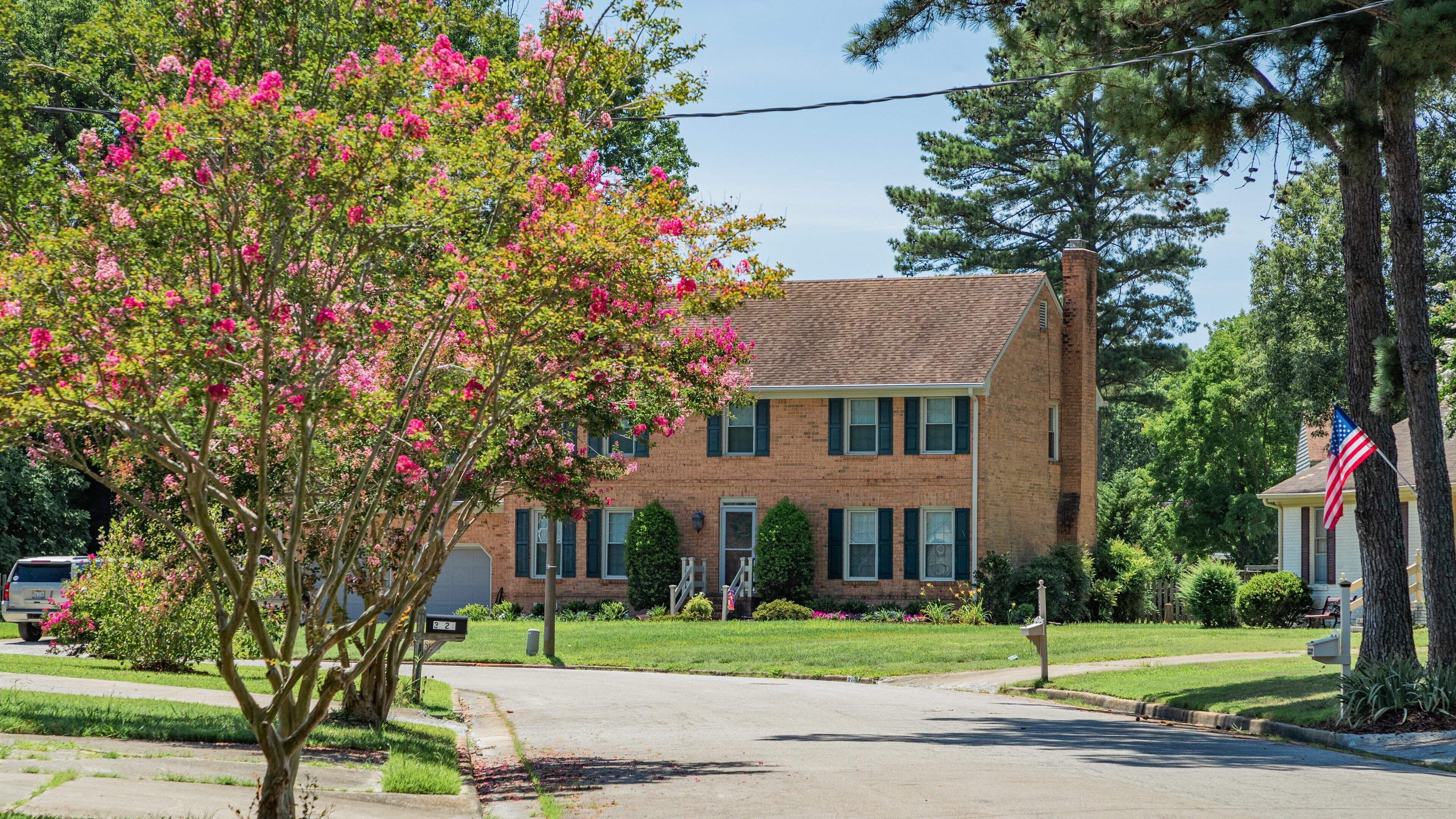 Churchland which includes a small town or village and wildflowers
