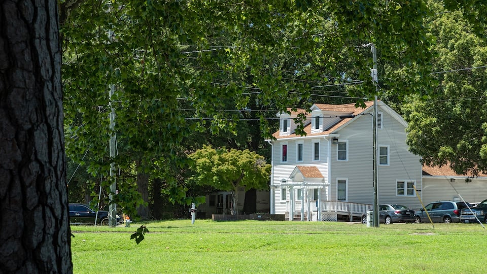 Churchland showing a garden and a house