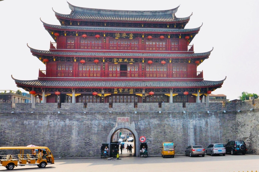 Guangji Gate Tower (廣濟門城樓) is one of four gate towers of ancient city wall. This is also one of the entrances to the old city, there are many old traditional houses with intricate decorations and carvings. There is also an arches street with many arches commemorating the scholars of days past. #InStone #Chaozhou #China #Guangdong #GuangjiGateTower #CityWall #Asia #architecture #red #History Photo Contest