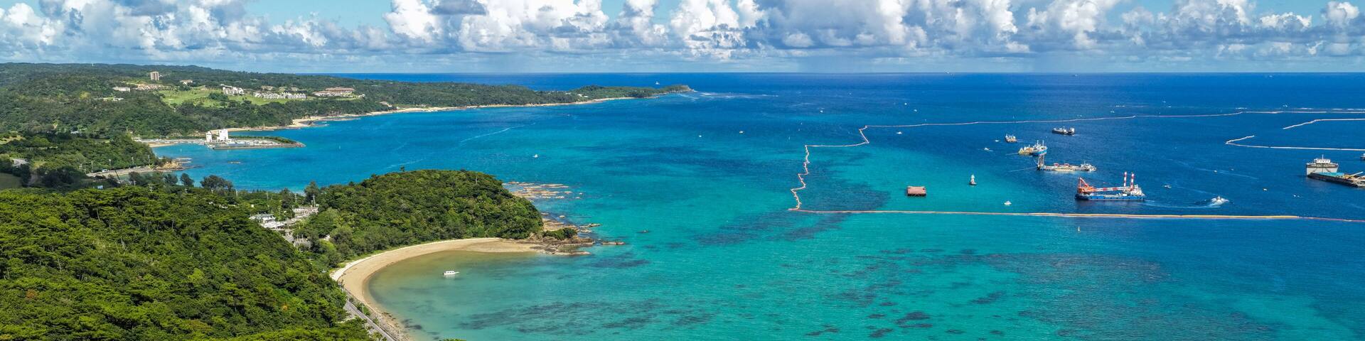 Aerial Editorial View of Oura Bay Coastline and Henoko Land Reclamation Area, Okinawa, Japan, Drone Photography
