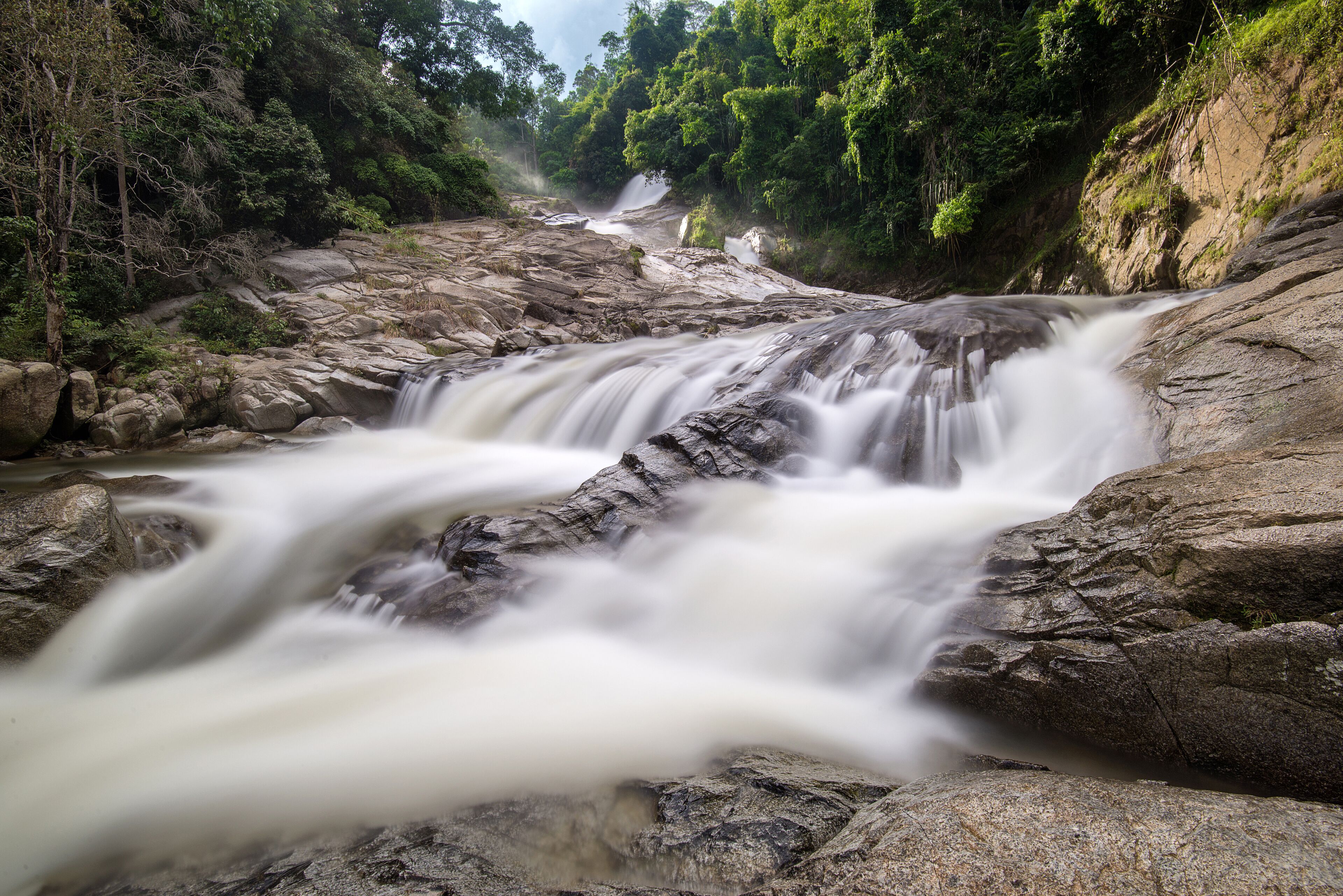 Silky smooth view of river flows at Chamang Waterfalls, Bentong, Pahang, Malaysia