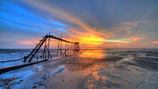 Sunset at the beach during low tide